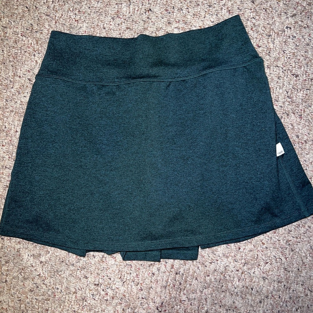 green workout skirt; pleated on the back
